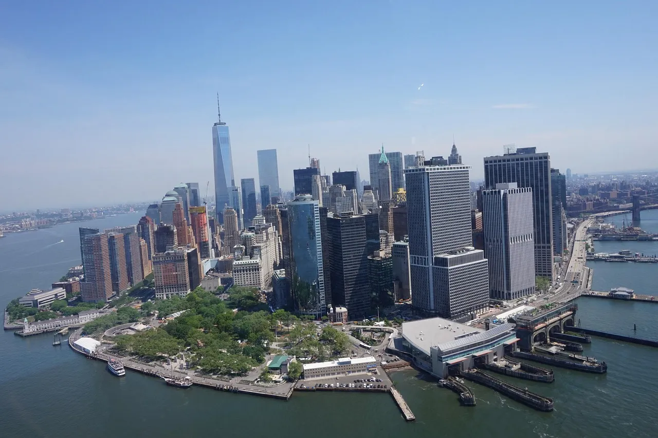 Aerial view of Lower Manhattan's financial district and harbor on a clear day